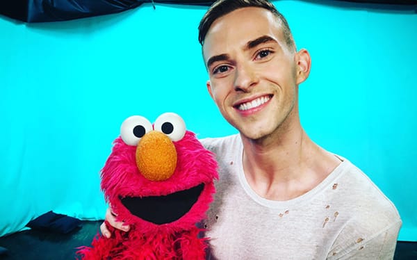Elmo celebrates out figure skater Adam Rippon’s win at the Winter Olympics