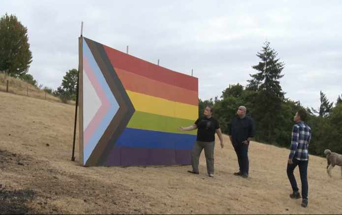 Residents build giant Pride flag in protest of school board banning “political” speech