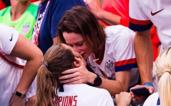 US football player Kelley O’Hara kisses girlfriend after World Cup victory
