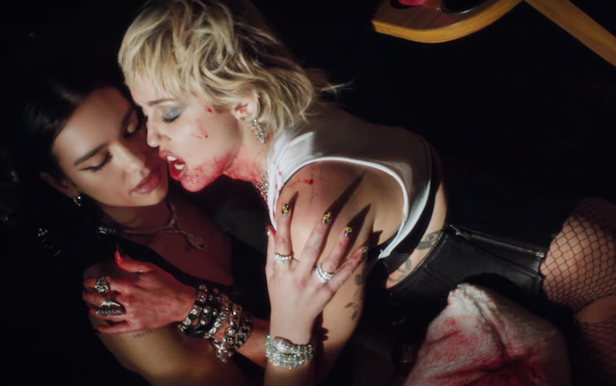 Miley Cyrus and Dua Lipa wreak bloody havoc in Prisoner video