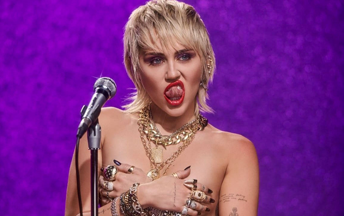 Miley Cyrus says she was attracted to girls “way before” boys