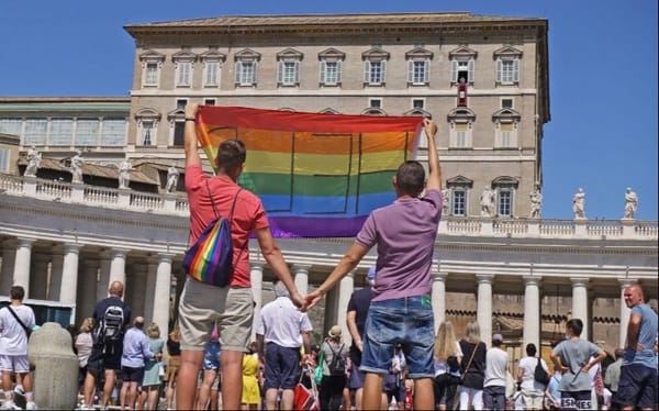 Gay Polish couple unfurl Pride flag outside of the Vatican asking the Pope for help