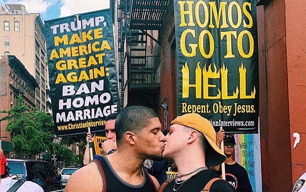 Anthony Bowens shares defiant gay kiss in front of homophobic protesters