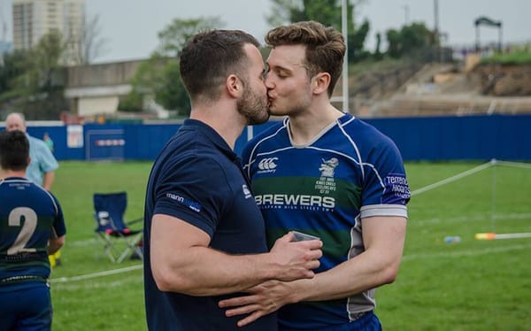 Rugby player Simon Dunn shares a kiss in defiance of Israel Folau’s anti-gay views